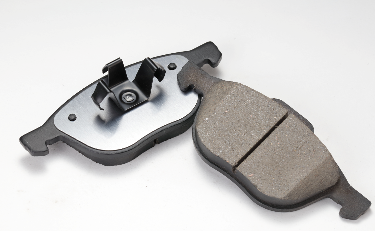 A pair of disc brake pads, showing the friction surface and backing plate, from the supplied manufacturer presentation
